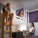 Three teenage girls in boarding accommodation at taunton school