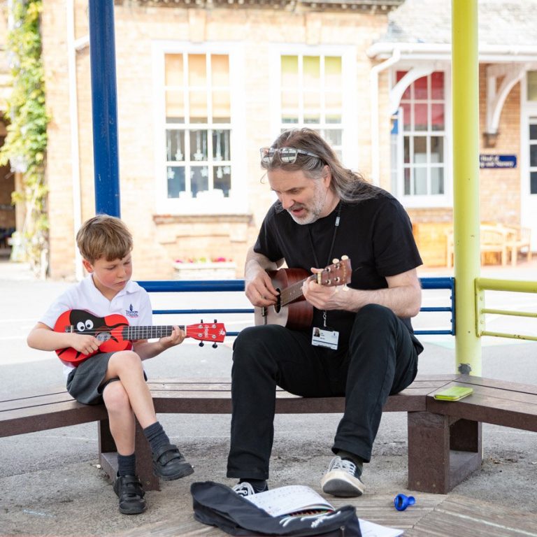 Taunton School Student Playing Ukuele with Music Teacher
