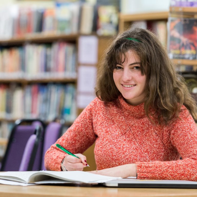 Taunton School Sixth Form Girl Writing In Library