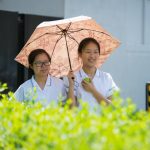 Taunton School International Students With Umbrella