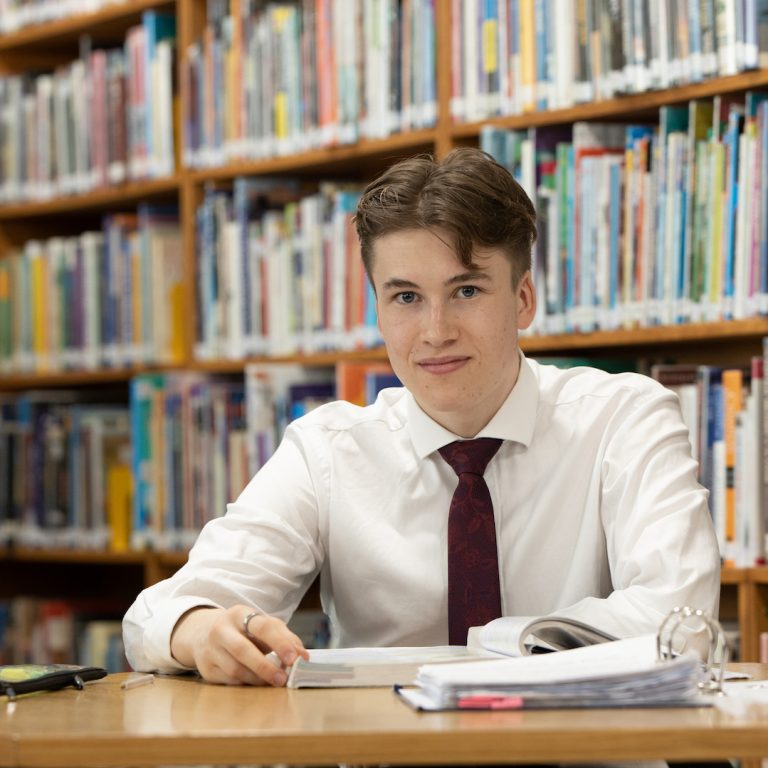 boy studying in library