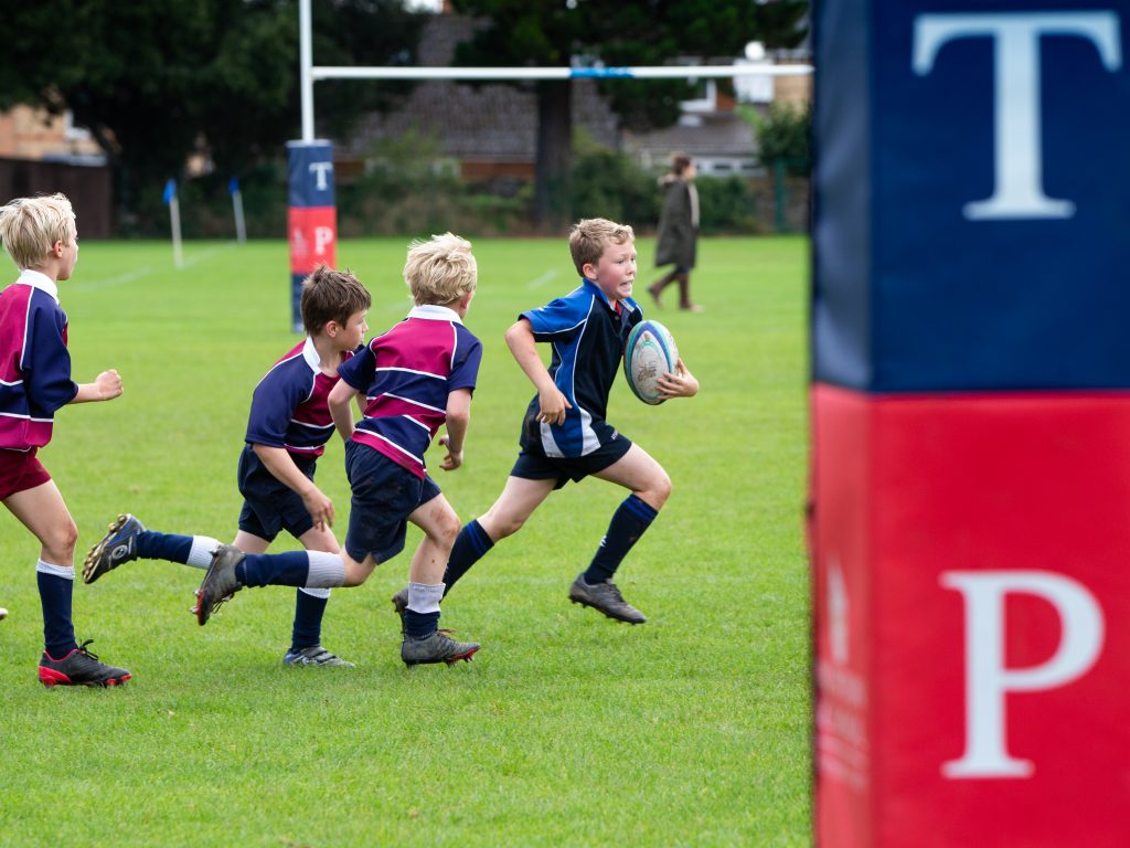 A group of students playing rugby