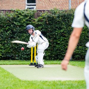 pupil playing cricket