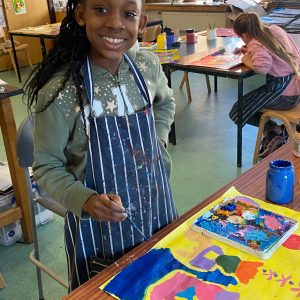 PUpil painting in enrichment class